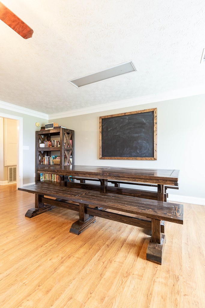 336 Clark Road Seale, AL 36875 - Photo 13 of 66 a living room with a flat screen tv and view of kitchen
