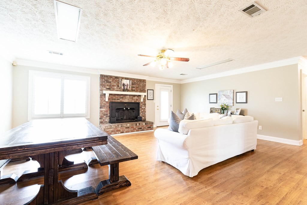 336 Clark Road Seale, AL 36875 - Photo 14 of 66 a living room with furniture and a fireplace
