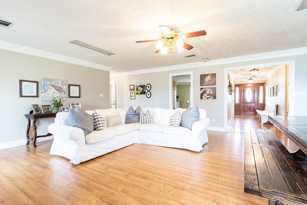 336 Clark Road Seale, AL 36875 - Photo 16 of 66 a living room with furniture and a chandelier