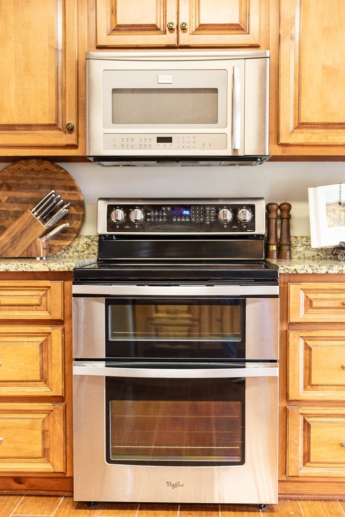 336 Clark Road Seale, AL 36875 - Photo 21 of 66 a stove top oven sitting inside of a kitchen