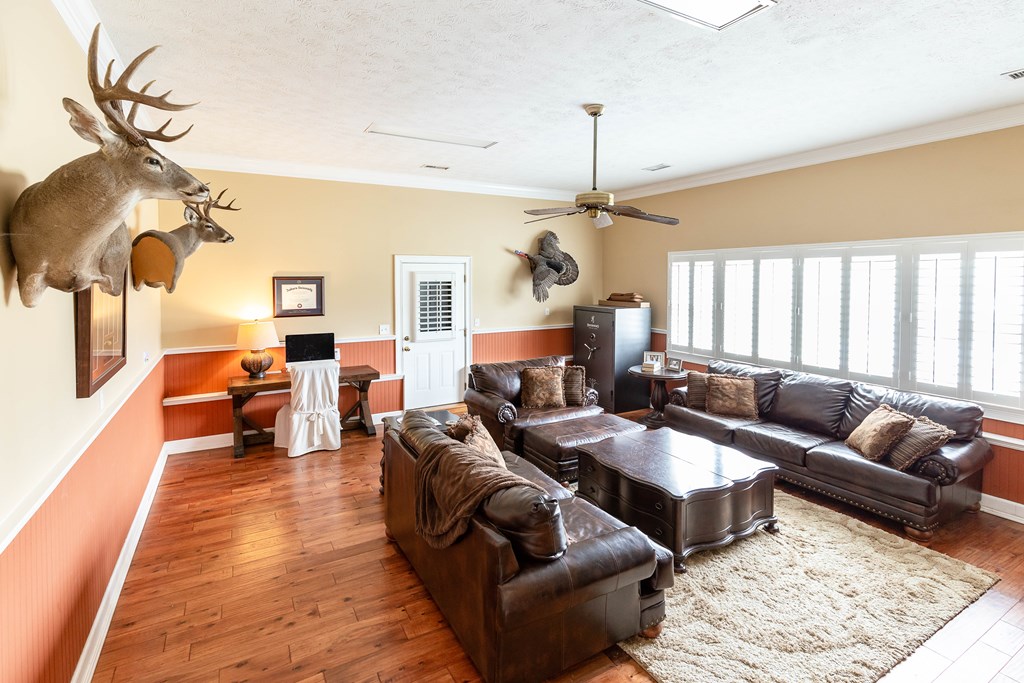 336 Clark Road Seale, AL 36875 - Photo 26 of 66 a living room with furniture or couch and a chandelier
