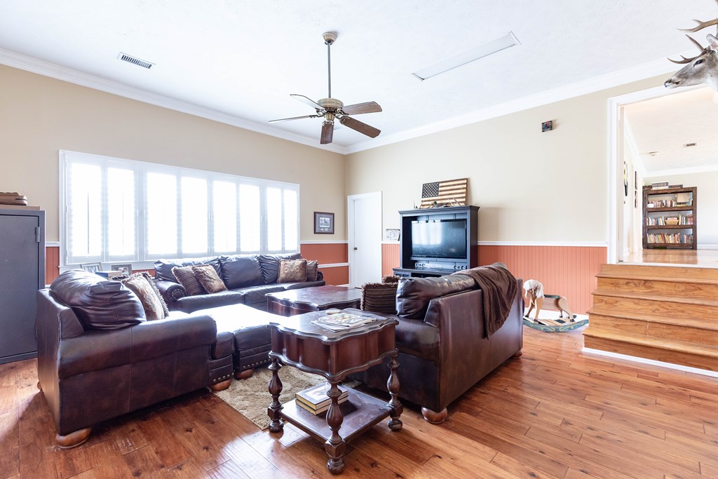 336 Clark Road Seale, AL 36875 - Photo 27 of 66 a living room with furniture and a flat screen tv