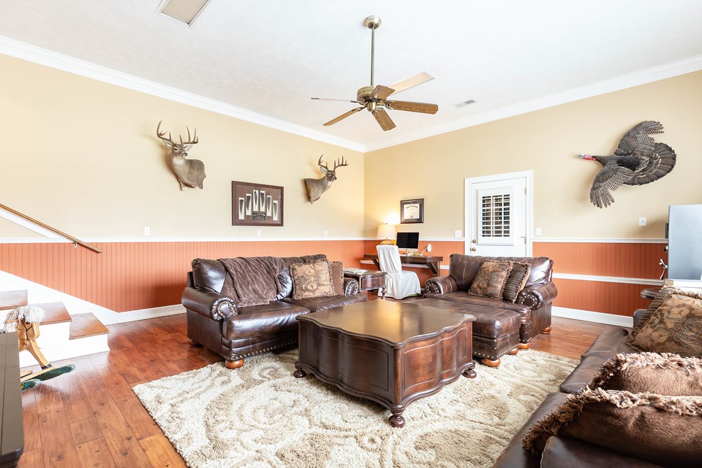 336 Clark Road Seale, AL 36875 - Photo 30 of 66 a living room with furniture and wooden floor