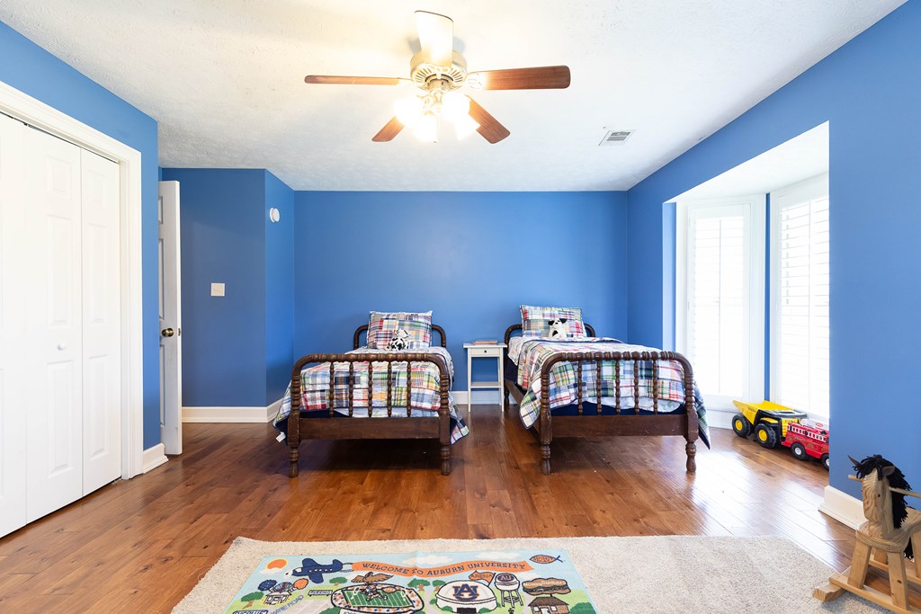 336 Clark Road Seale, AL 36875 - Photo 38 of 66 a bedroom with furniture and a wooden floor