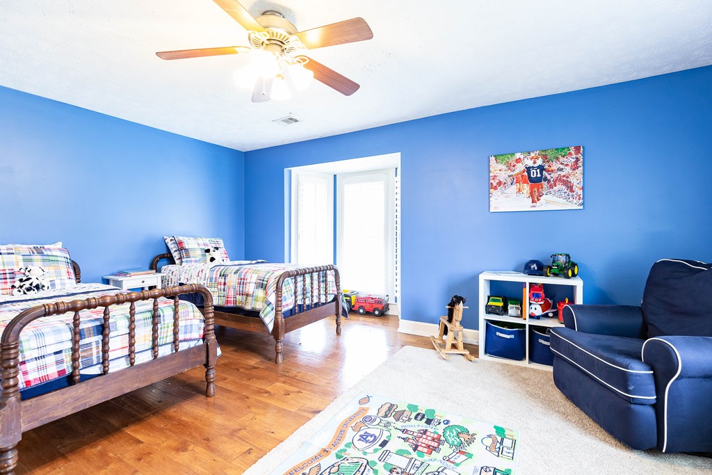 336 Clark Road Seale, AL 36875 - Photo 39 of 66 a bedroom with furniture and a book shelf