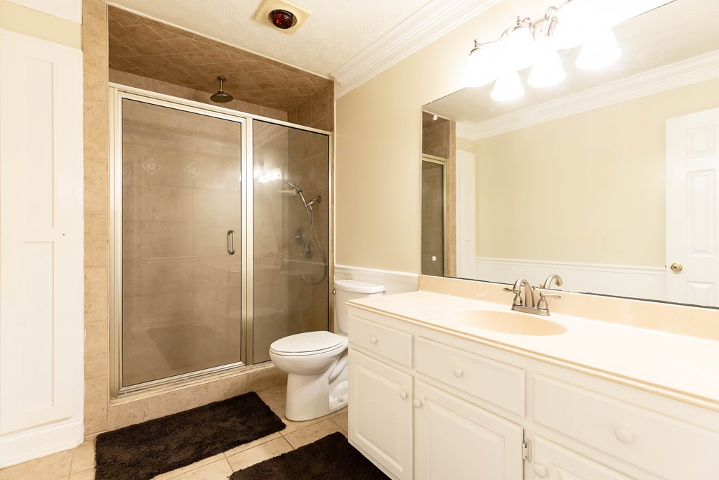 336 Clark Road Seale, AL 36875 - Photo 43 of 66 a bathroom with a sink a toilet a mirror and shower