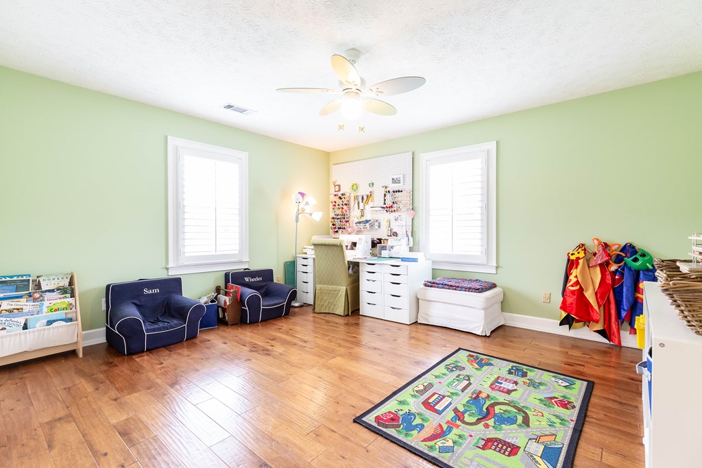 336 Clark Road Seale, AL 36875 - Photo 47 of 66 a living room with furniture and a baby crib
