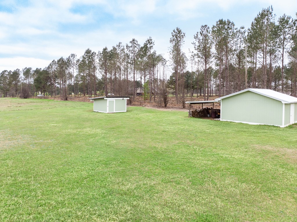 336 Clark Road Seale, AL 36875 - Photo 54 of 66 a view of a house with a yard and sitting area