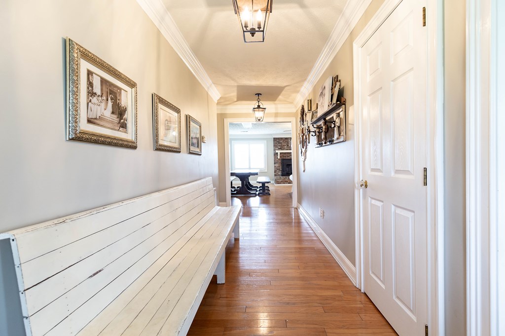 336 Clark Road Seale, AL 36875 - Photo 7 of 66 a hallway with wooden floor and windows