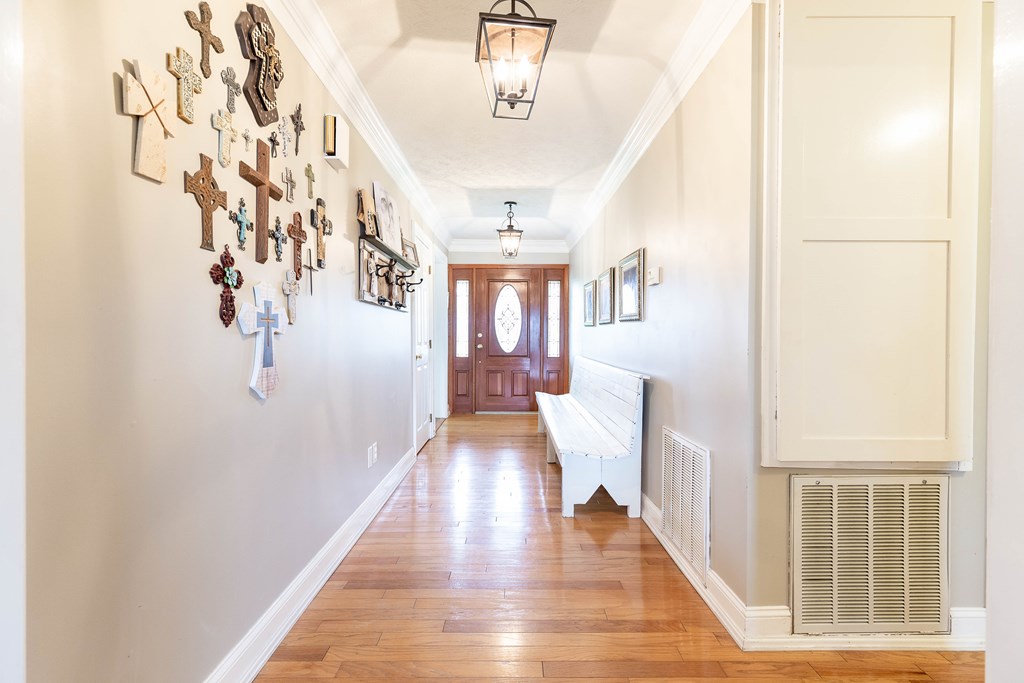 336 Clark Road Seale, AL 36875 - Photo 10 of 66 a view of a hallway with wooden floor and staircase