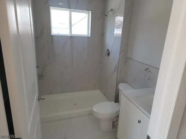 a bathroom with a sink and toilet