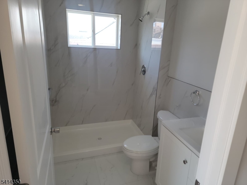 118 Shephard Avenue Newark, NJ 07112 - Photo 4 of 15 a bathroom with a sink and toilet