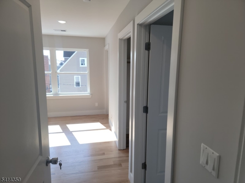 118 Shephard Avenue Newark, NJ 07112 - Photo 6 of 15 a view of an empty room and window