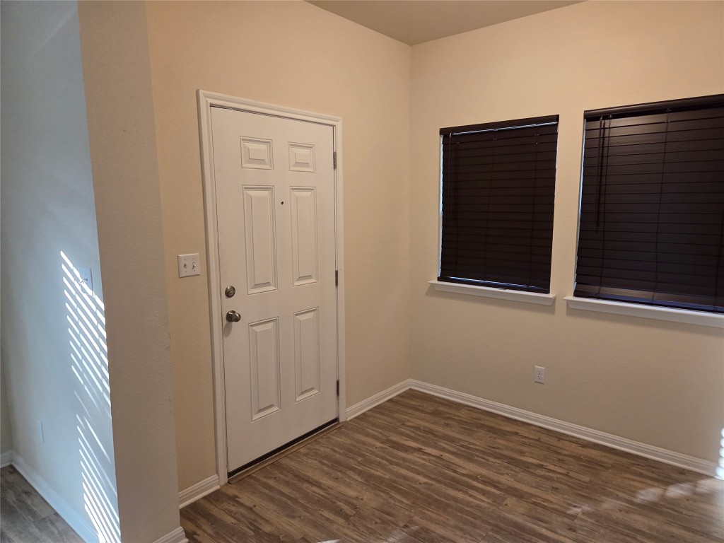 8136 Daisy Cutter Crossing Georgetown, TX 78626 - Photo 15 of 27 a view of a small space with wooden floor and a window