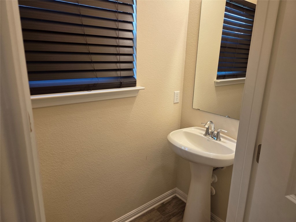 8136 Daisy Cutter Crossing Georgetown, TX 78626 - Photo 17 of 27 a bathroom with a sink and mirror