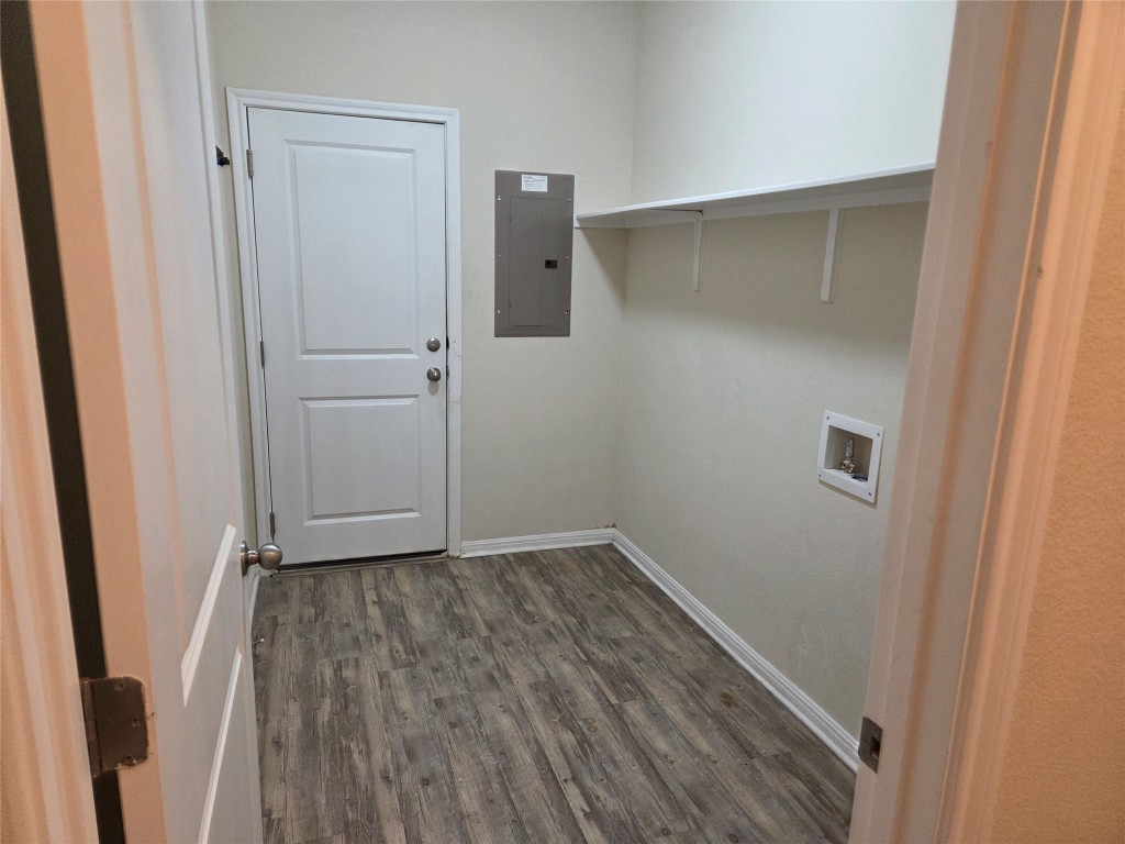 8136 Daisy Cutter Crossing Georgetown, TX 78626 - Photo 18 of 27 a view of an empty room with wooden floor
