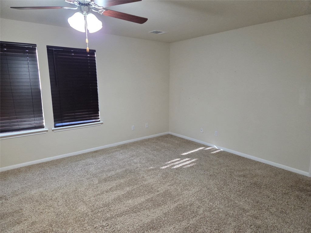 8136 Daisy Cutter Crossing Georgetown, TX 78626 - Photo 20 of 27 a view of an empty room with a window