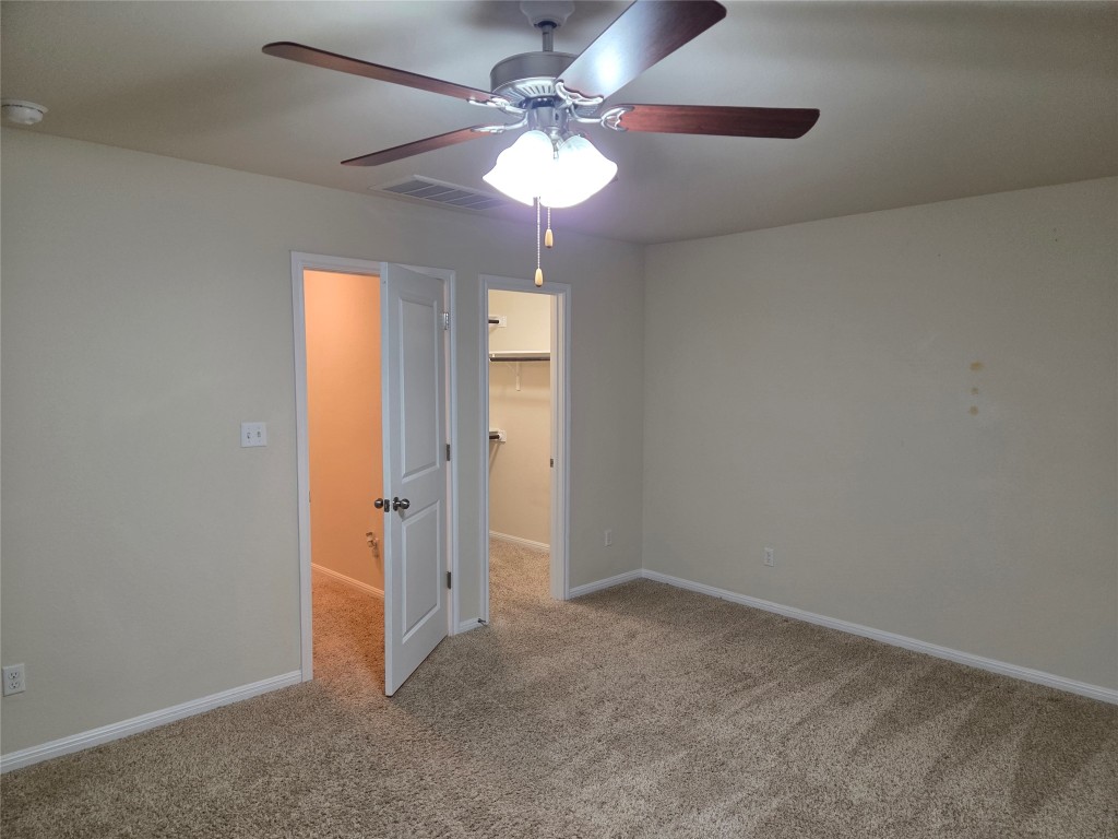 8136 Daisy Cutter Crossing Georgetown, TX 78626 - Photo 21 of 27 wooden floor in an empty room with a window