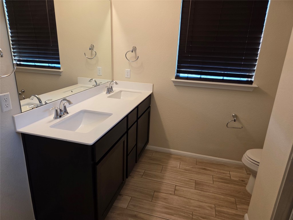8136 Daisy Cutter Crossing Georgetown, TX 78626 - Photo 24 of 27 a bathroom with a sink and a mirror