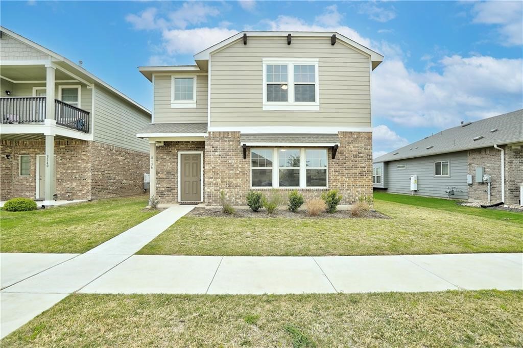 8136 Daisy Cutter Crossing Georgetown, TX 78626 - Photo 3 of 27 a front view of a house with a yard
