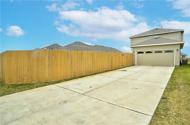 a view of a big room with wooden fence