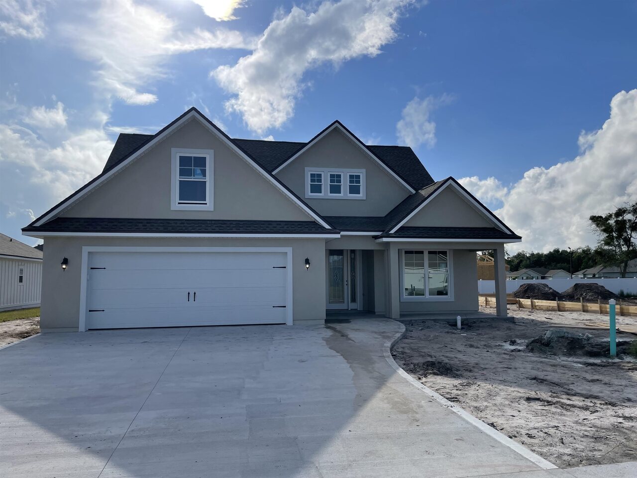 104 Pomegranate Road Kingsland, GA 31548 - Photo 1 of 1 a front view of a house with a yard