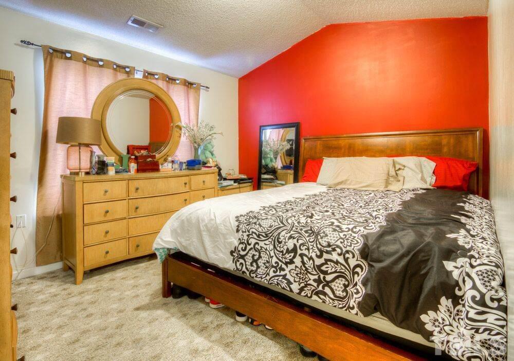 3609 Croydon Mill Way Raleigh, NC 27616 - Photo 14 of 15 a bed sitting in a bedroom next to a window and dresser