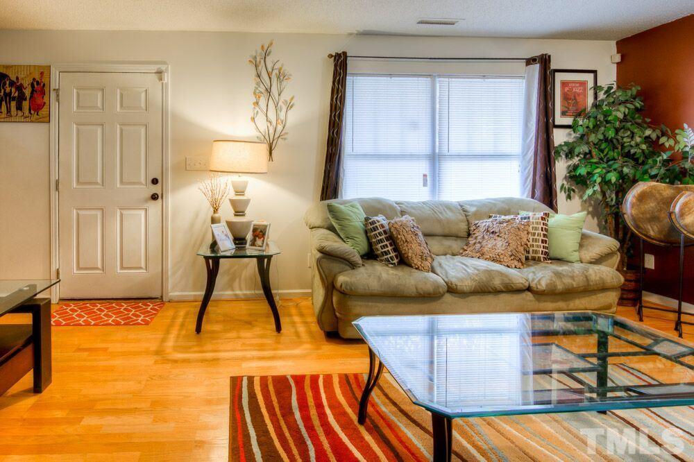 3609 Croydon Mill Way Raleigh, NC 27616 - Photo 3 of 15 a living room with furniture and a white wooden floor