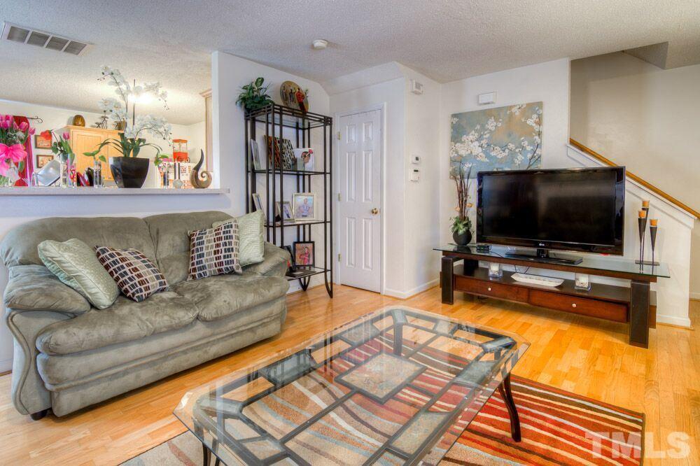 3609 Croydon Mill Way Raleigh, NC 27616 - Photo 4 of 15 a living room with furniture and a flat screen tv