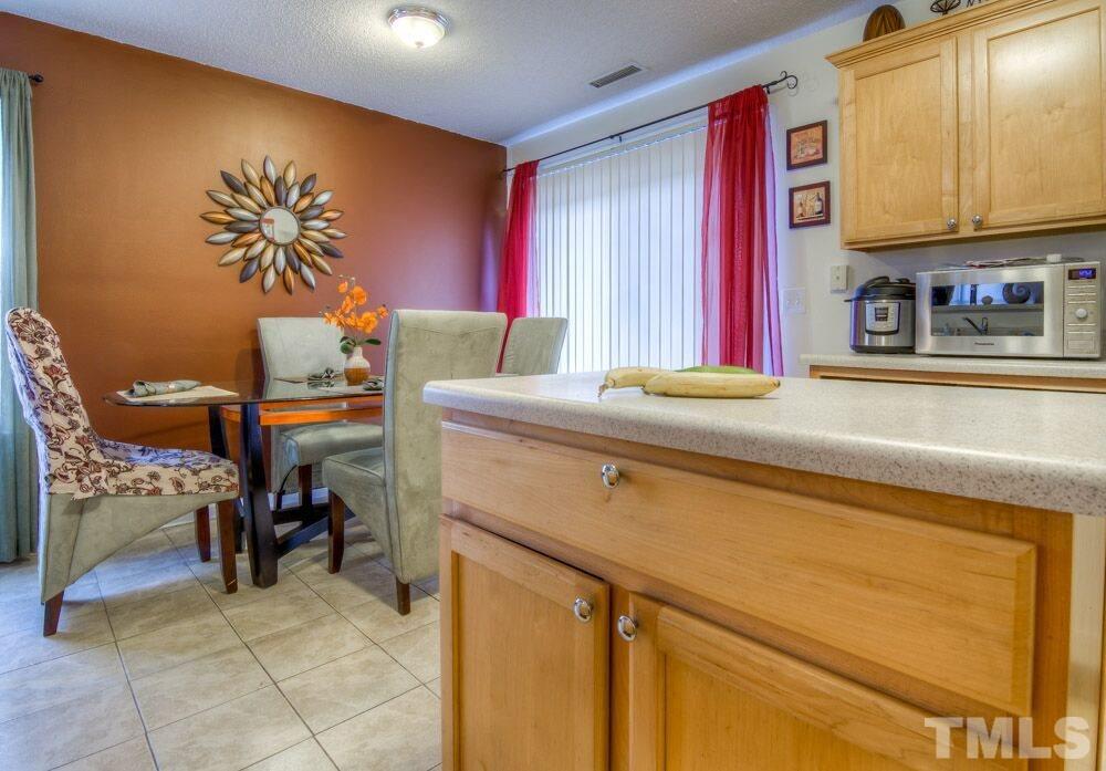 3609 Croydon Mill Way Raleigh, NC 27616 - Photo 5 of 15 a room with a table and chairs