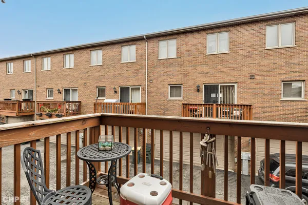a view of a brick deck and a patio