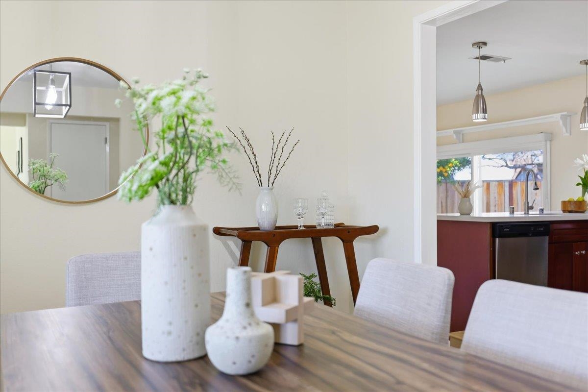 7109 Elba Way Dublin, CA 94568 - Photo 18 of 60 a living room with furniture a potted plant and a wooden floor