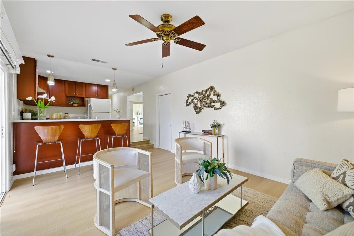 7109 Elba Way Dublin, CA 94568 - Photo 28 of 60 a living room with furniture kitchen view and a table