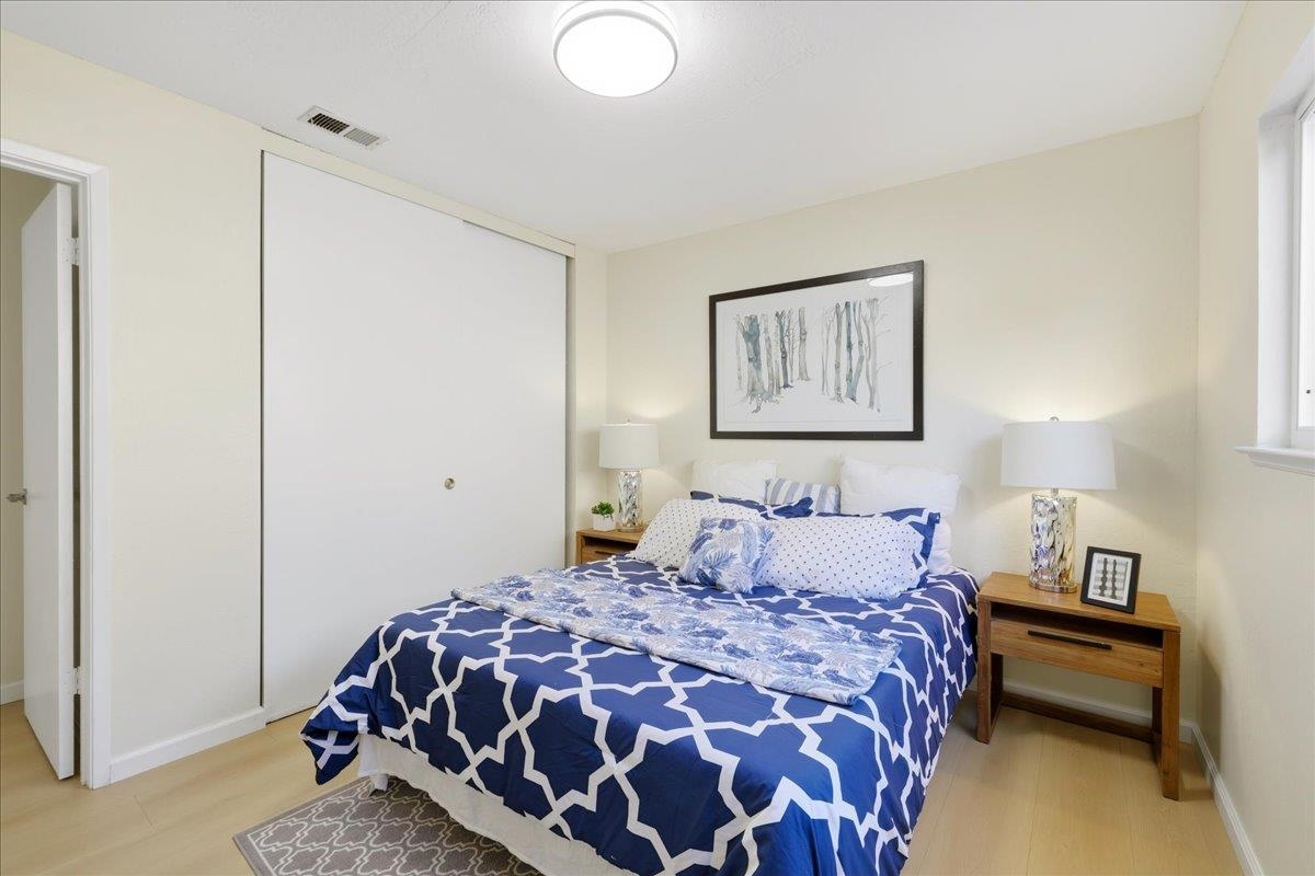 7109 Elba Way Dublin, CA 94568 - Photo 32 of 60 a bedroom with a bed and painting on the wall