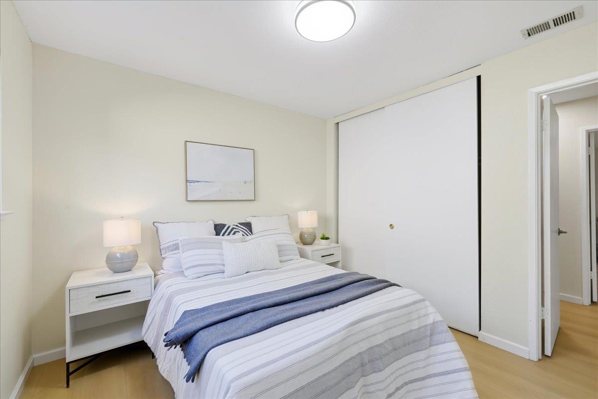 7109 Elba Way Dublin, CA 94568 - Photo 34 of 60 a bedroom with a bed and a painting on the wall