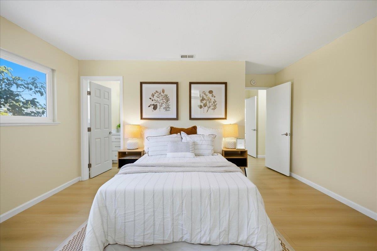 7109 Elba Way Dublin, CA 94568 - Photo 41 of 60 a bedroom with a bed and painting on the wall