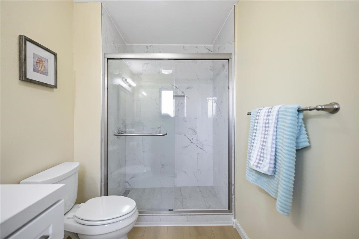 7109 Elba Way Dublin, CA 94568 - Photo 43 of 60 a bathroom with a shower and toilet