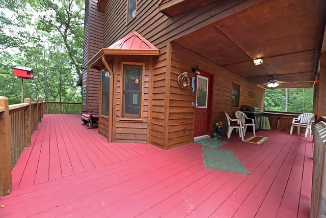a view of a patio with a table and chairs