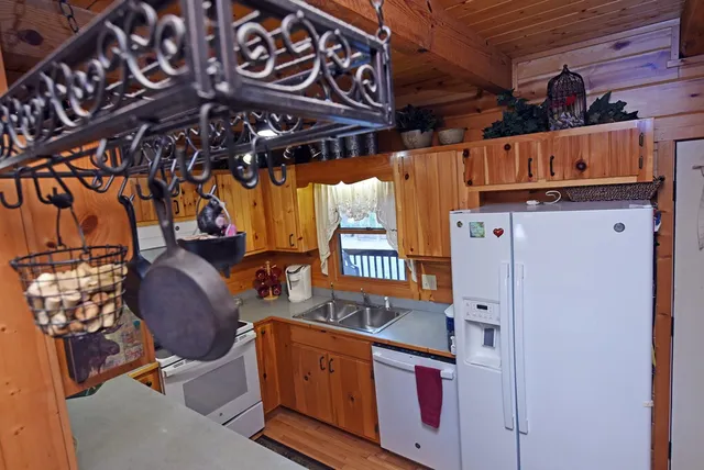 a view of a patio with table and chairs with wooden floor and outdoor seating