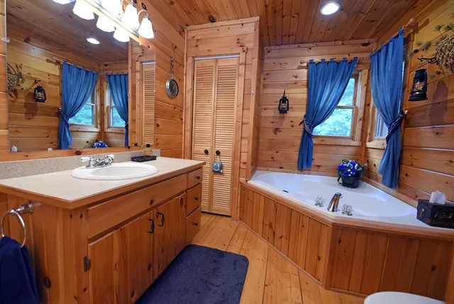 a room with pool table and flat screen tv