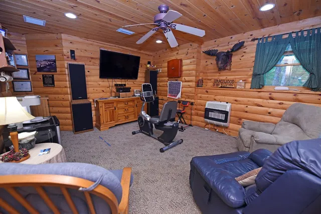 a view of a livingroom with furniture hardwood floor and staircase