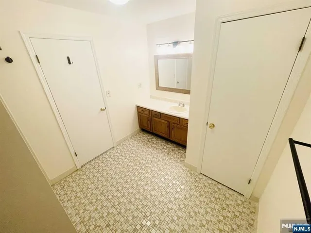 a bathroom with a sink and a shower