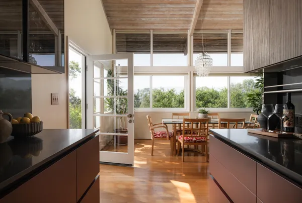 a kitchen with lots of counter top space and dining table