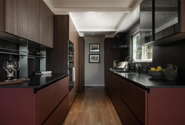 a kitchen with stainless steel appliances a sink stove and cabinets