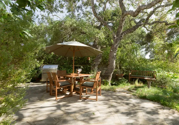 a view of a sitting area with furniture and backyard
