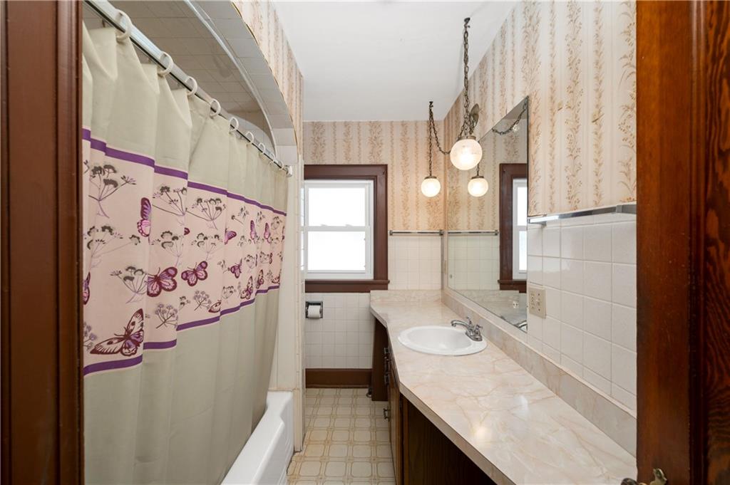 125 Merritt Drive Butler, PA 16001 - Photo 13 of 38 a bathroom with a sink a mirror and a shower