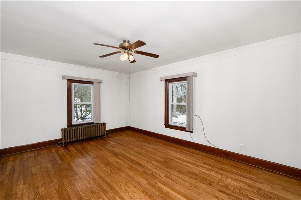 125 Merritt Drive Butler, PA 16001 - Photo 17 of 38 a view of empty room with wooden floor and fan
