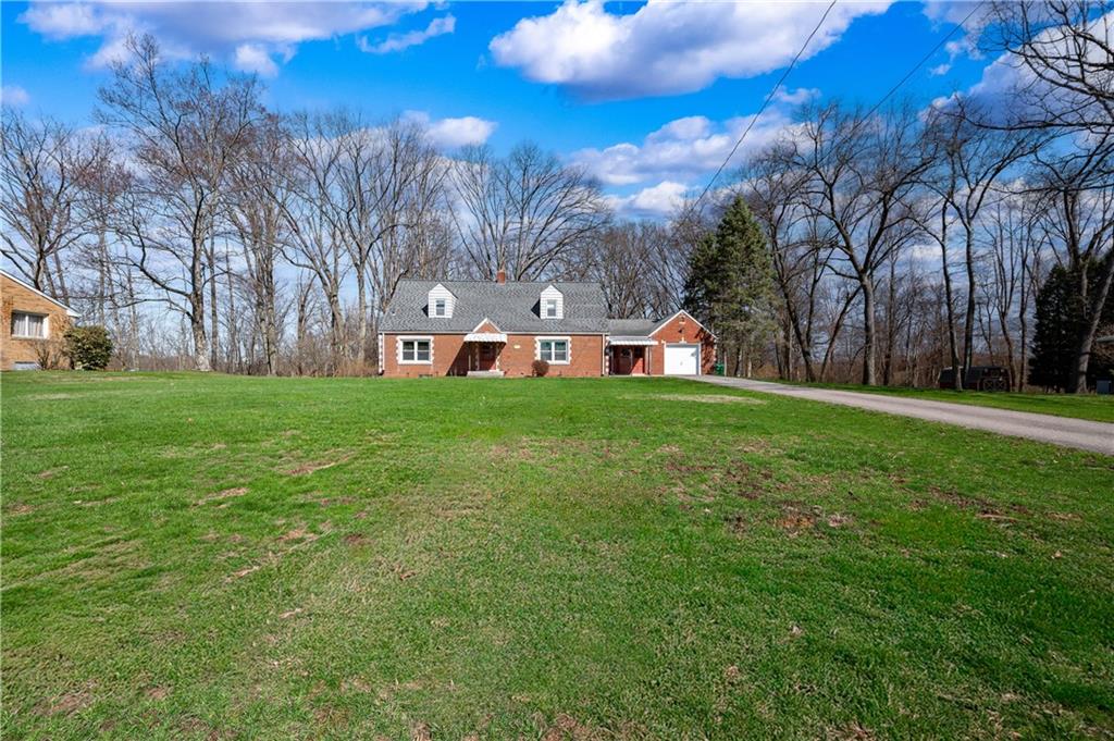 125 Merritt Drive Butler, PA 16001 - Photo 32 of 38 a view of a building with a big yard