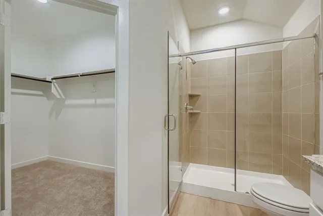a bathroom with a glass shower door