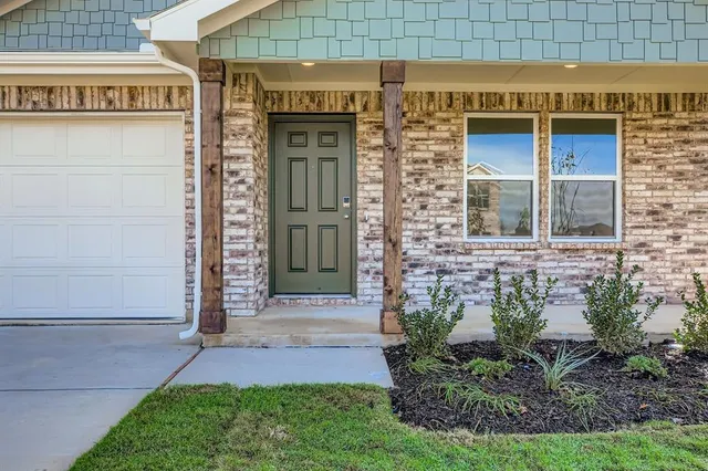 a front view of a building with garden